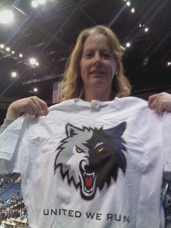 Joann holds up prize tee-shirt